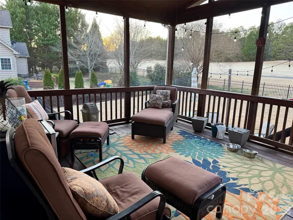 a view of a patio with a yard