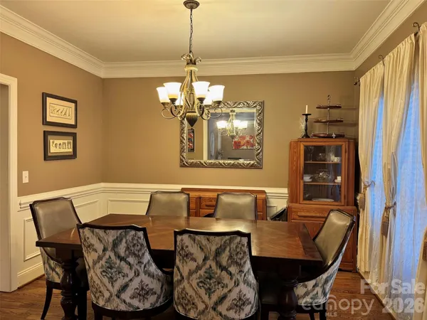 a view of a dining room with furniture and windows