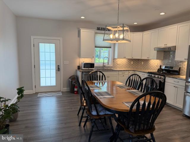209 3rd Street Crumpton, MD 21628 - Photo 12 of 47 a view of a dining room with furniture window and wooden floor