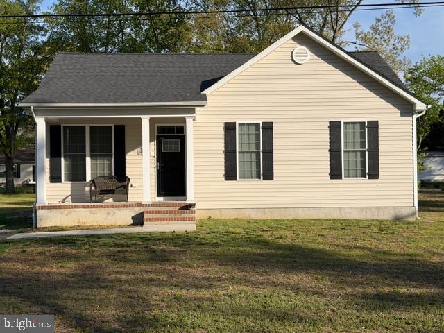 209 3rd Street Crumpton, MD 21628 - Photo 2 of 108 a front view of a house with a yard