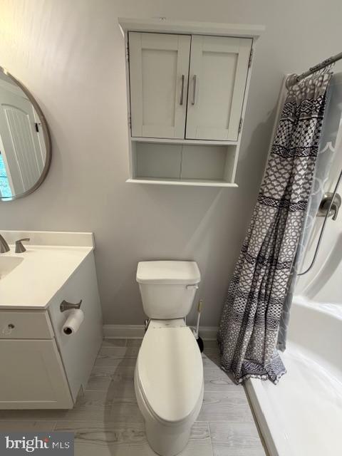 209 3rd Street Crumpton, MD 21628 - Photo 35 of 47 a bathroom with a toilet sink and mirror