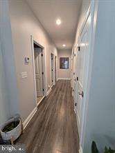 209 3rd Street Crumpton, MD 21628 - Photo 37 of 108 a view of a hallway with wooden floor and a bathroom