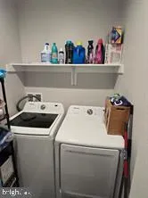 a bedroom with bed and flat screen tv