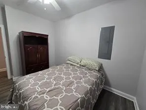 a bedroom with a bed and a flat screen television