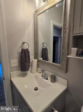209 3rd Street Crumpton, MD 21628 - Photo 59 of 108 a bathroom with a sink and a mirror