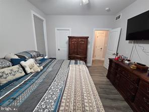 209 3rd Street Crumpton, MD 21628 - Photo 65 of 108 a living room with furniture and a flat screen tv