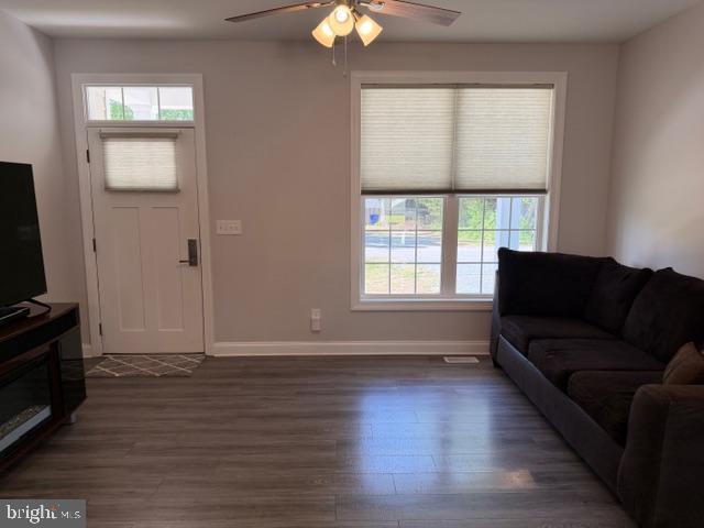 209 3rd Street Crumpton, MD 21628 - Photo 7 of 47 a living room with couches and a flat screen tv with wooden floor