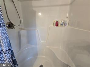 209 3rd Street Crumpton, MD 21628 - Photo 77 of 108 a bathroom with a shower