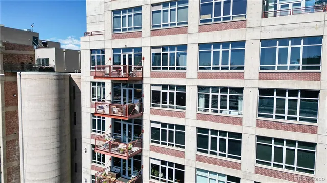 a front view of a building with a lot of windows