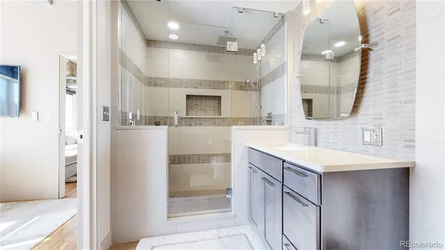 a bathroom with a sink double vanity and a mirror