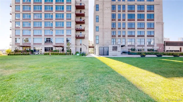 a front view of a building with garden