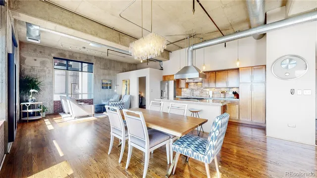 a view of a dining area with furniture and wooden floor