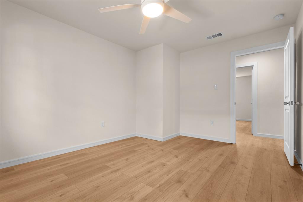 4325 Highland Street Lancaster, TX 75134 - Photo 20 of 35 a view of empty room with wooden floor and fan