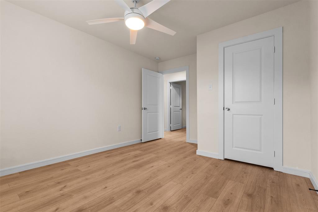 4325 Highland Street Lancaster, TX 75134 - Photo 23 of 35 a view of an empty room with wooden floor