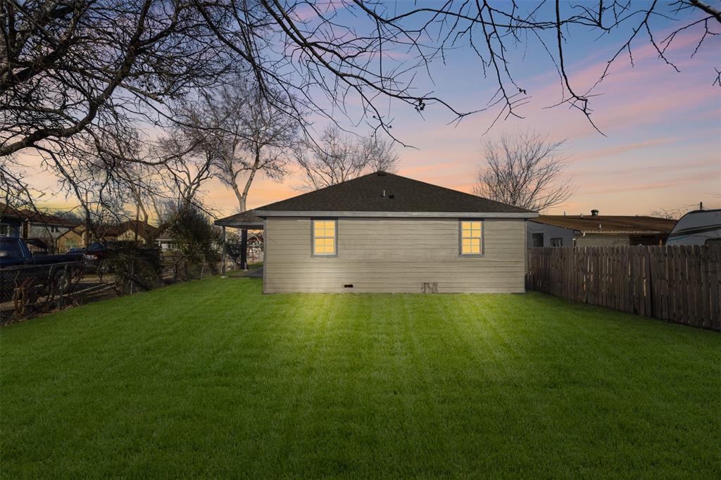 4325 Highland Street Lancaster, TX 75134 - Photo 30 of 35 a backyard of a house with lots of green space