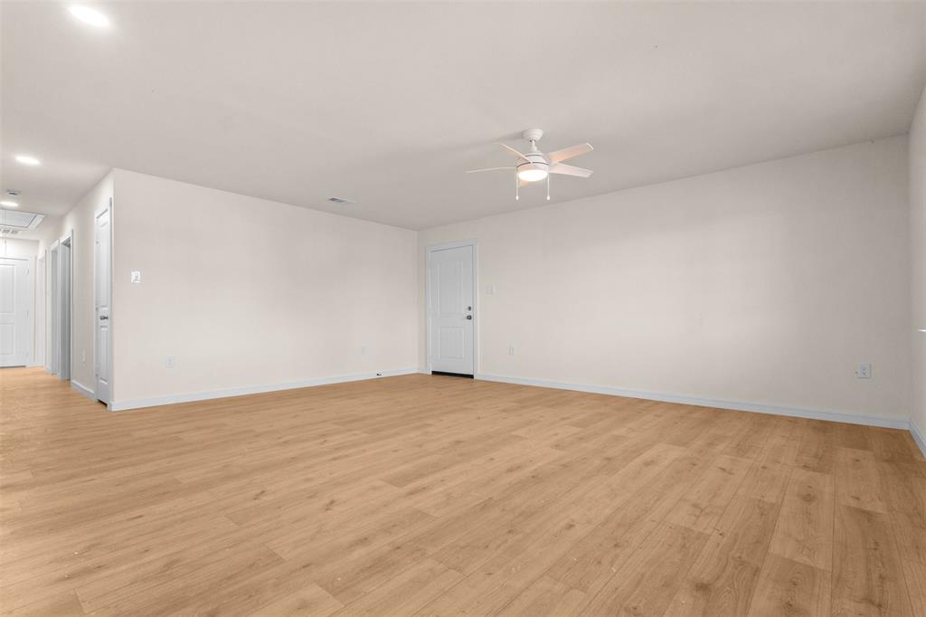 4325 Highland Street Lancaster, TX 75134 - Photo 6 of 35 a view of an empty room with wooden floor