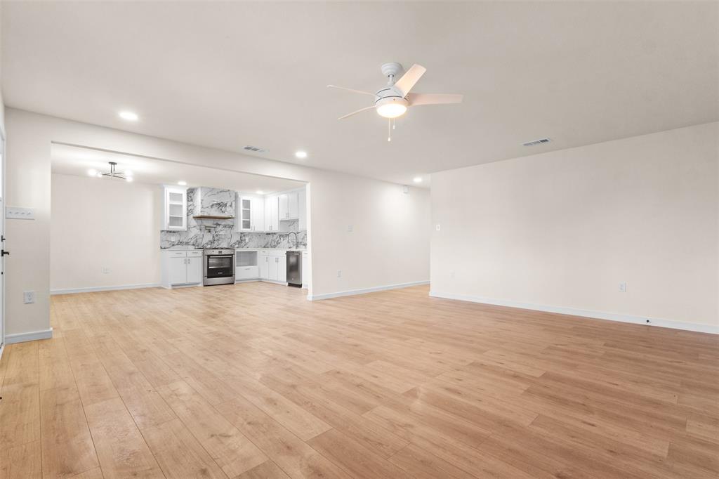 4325 Highland Street Lancaster, TX 75134 - Photo 7 of 35 a view of a kitchen with a sink and a refrigerator
