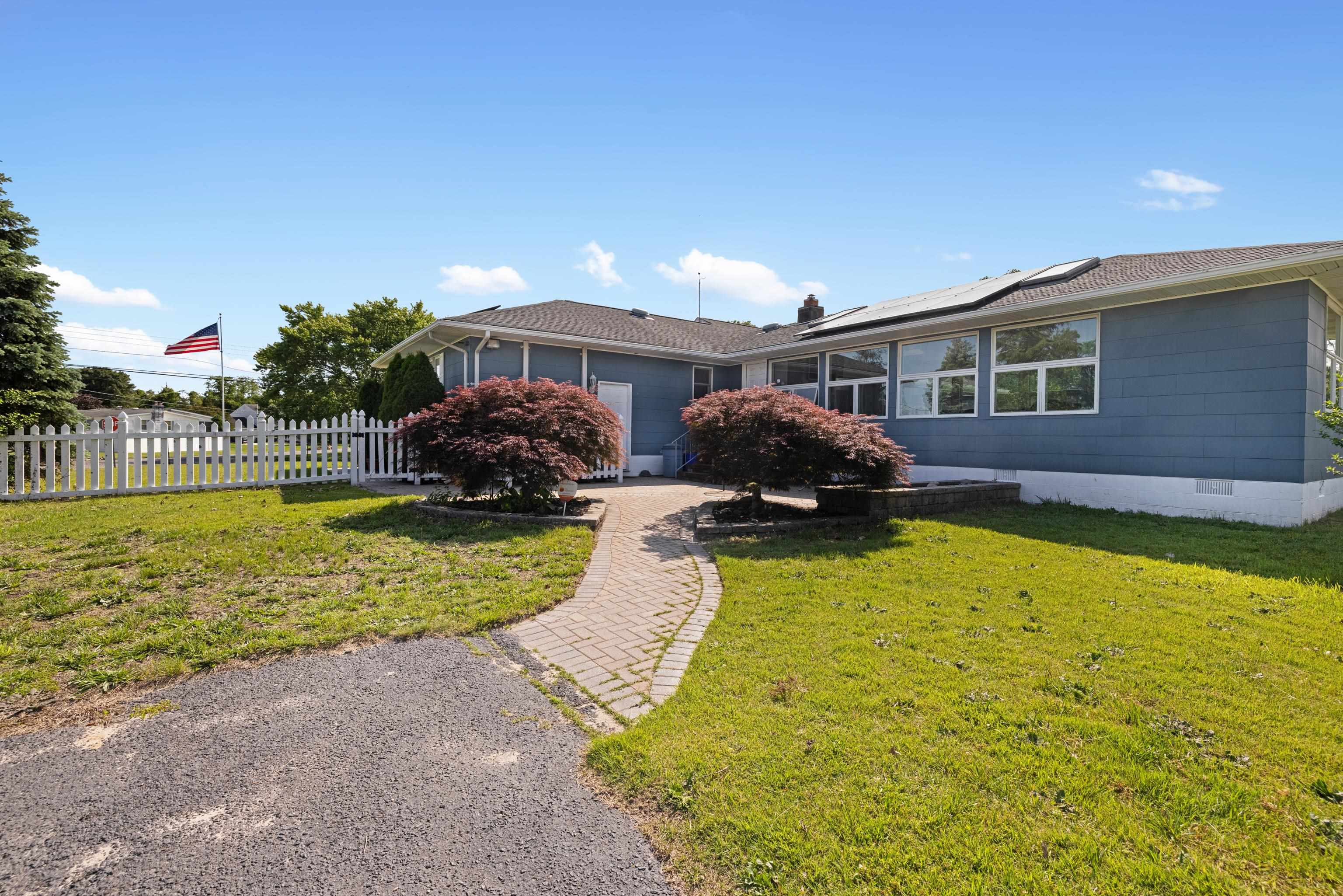 102 Teal Road Rio Grande, NJ 08242 - Photo 14 of 49 a swimming pool with outdoor seating and yard