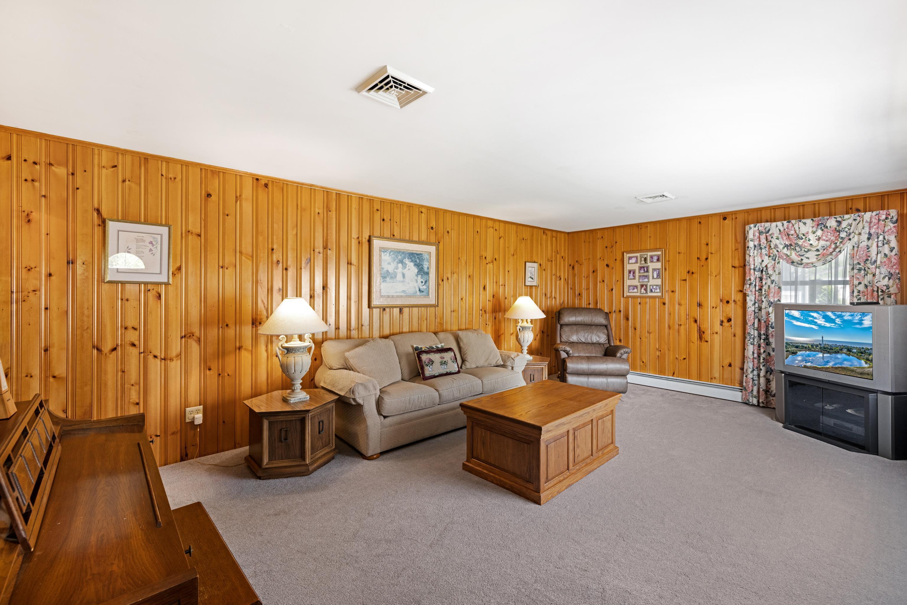 102 Teal Road Rio Grande, NJ 08242 - Photo 16 of 49 a living room with furniture and a flat screen tv