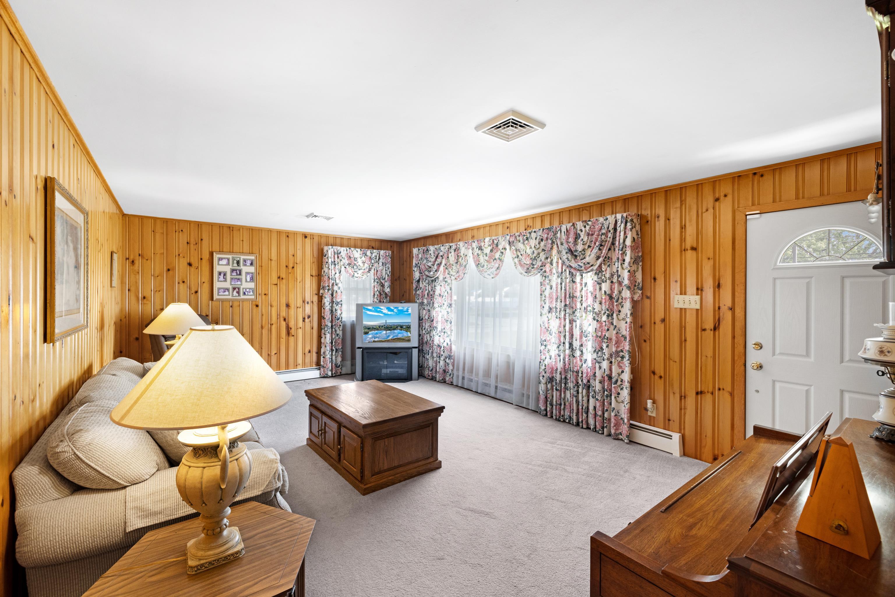 102 Teal Road Rio Grande, NJ 08242 - Photo 17 of 49 a living room with furniture and a large window