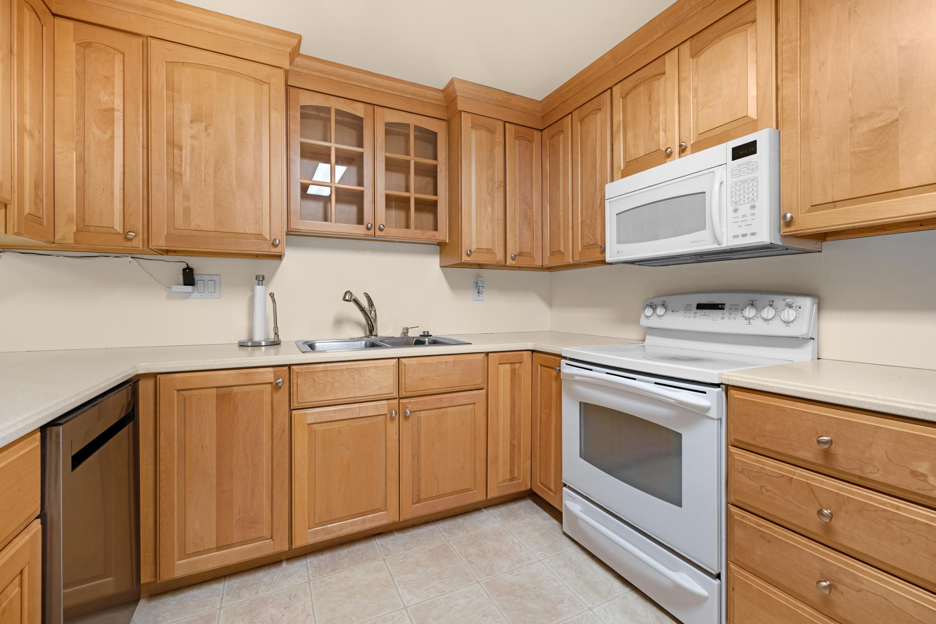 102 Teal Road Rio Grande, NJ 08242 - Photo 18 of 49 a kitchen with granite countertop cabinets stainless steel appliances and sink