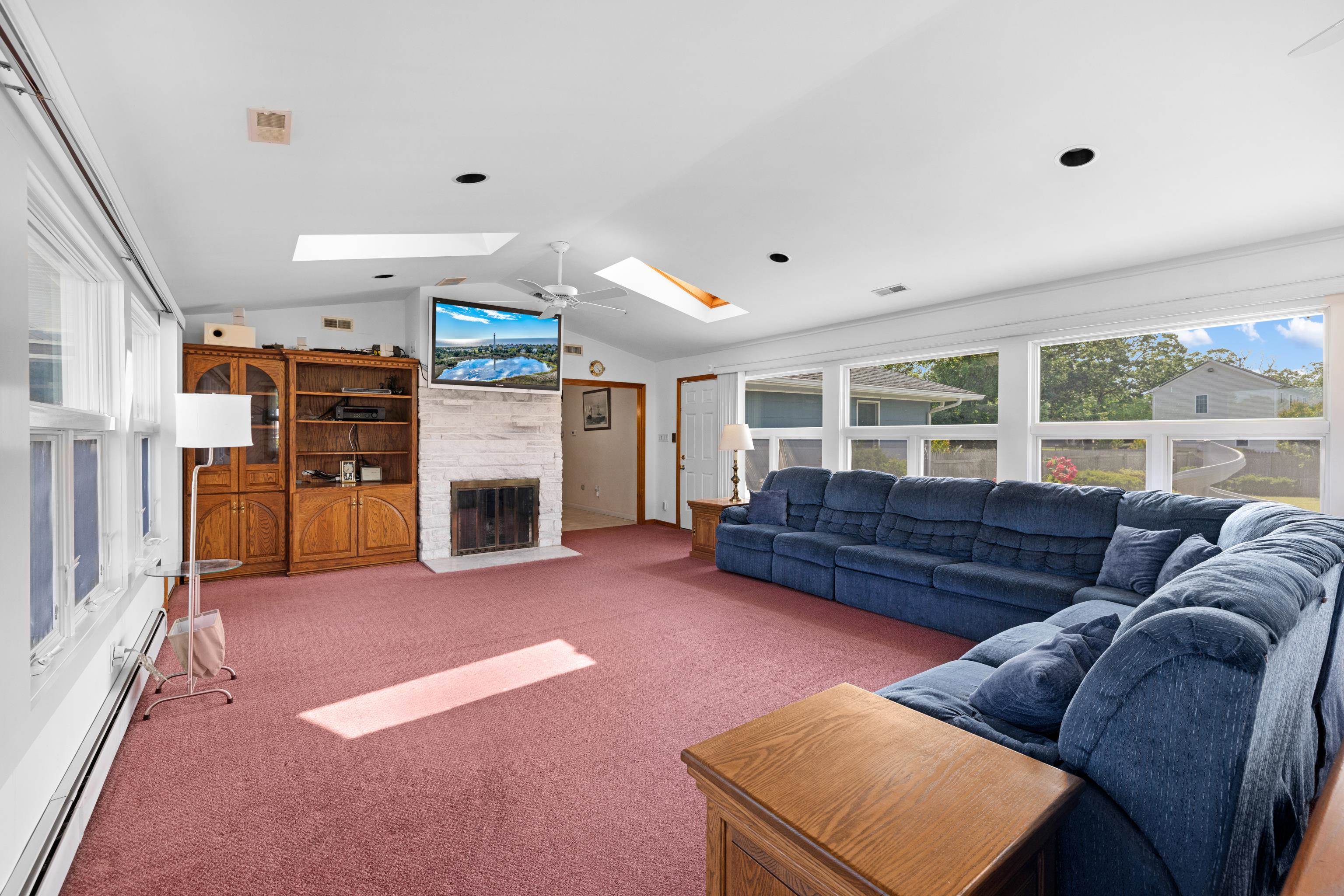 102 Teal Road Rio Grande, NJ 08242 - Photo 22 of 49 a living room with furniture and a fireplace