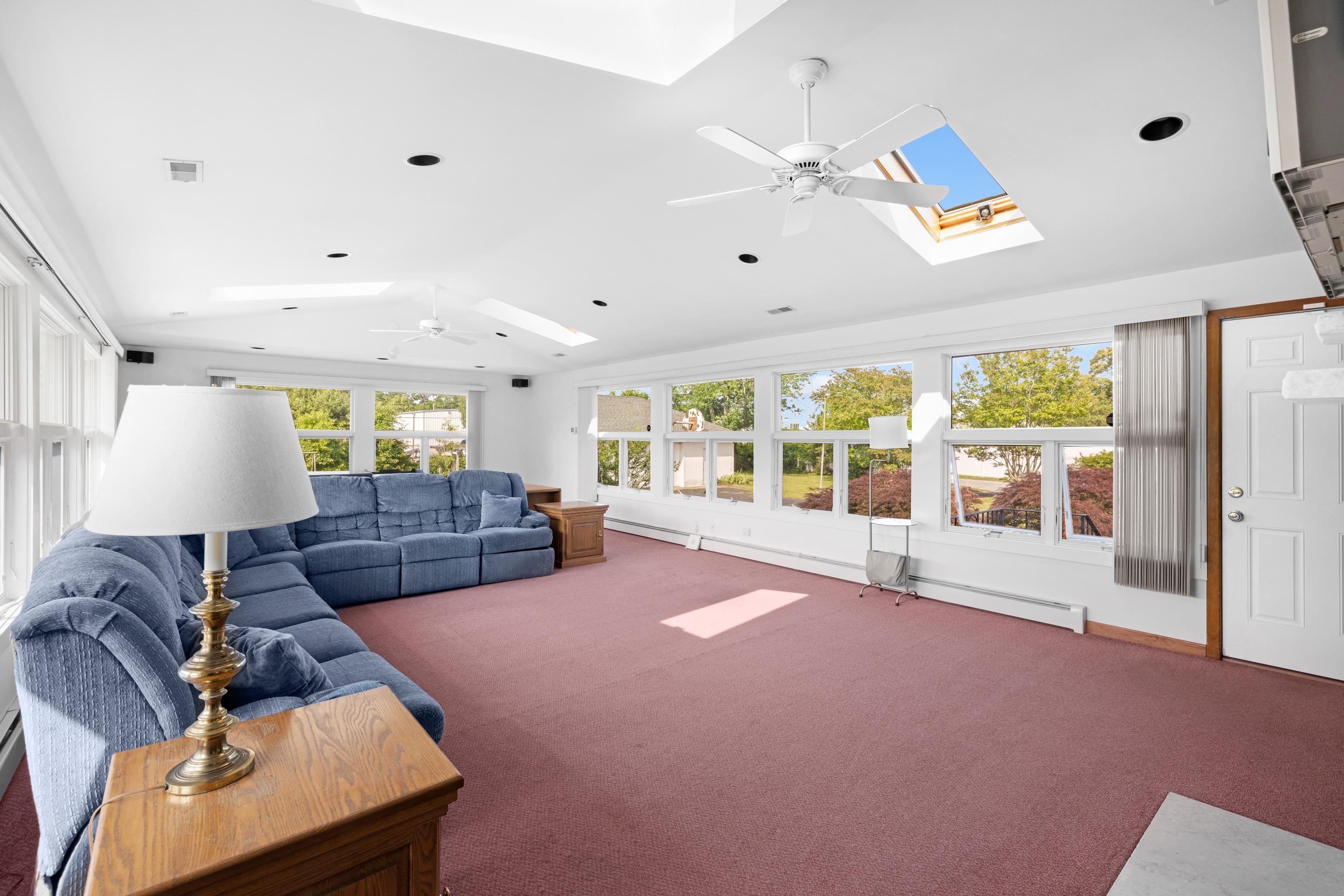 102 Teal Road Rio Grande, NJ 08242 - Photo 23 of 49 a living room with furniture and a large window