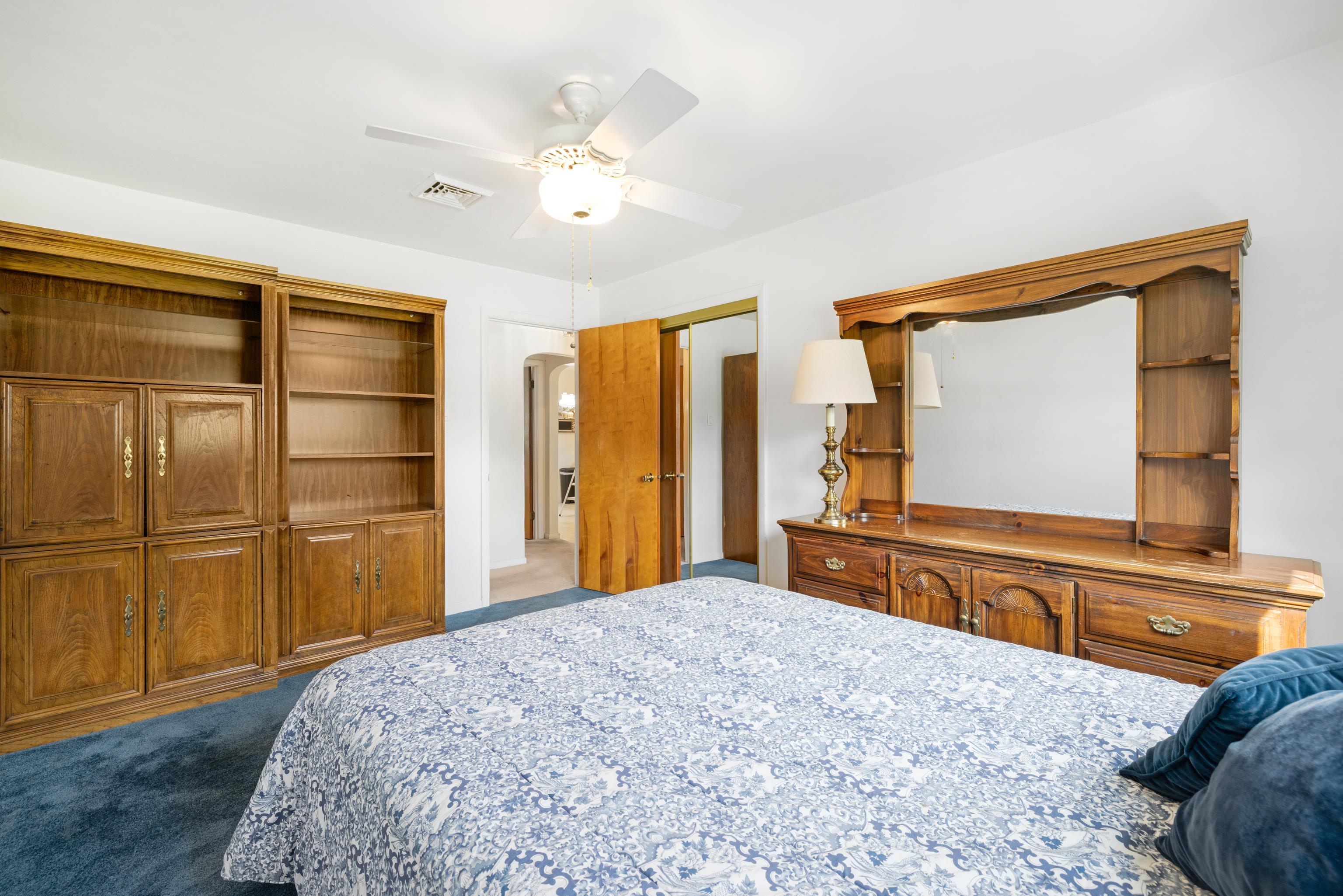 102 Teal Road Rio Grande, NJ 08242 - Photo 26 of 49 a bedroom with a bed and a large mirror on the dresser