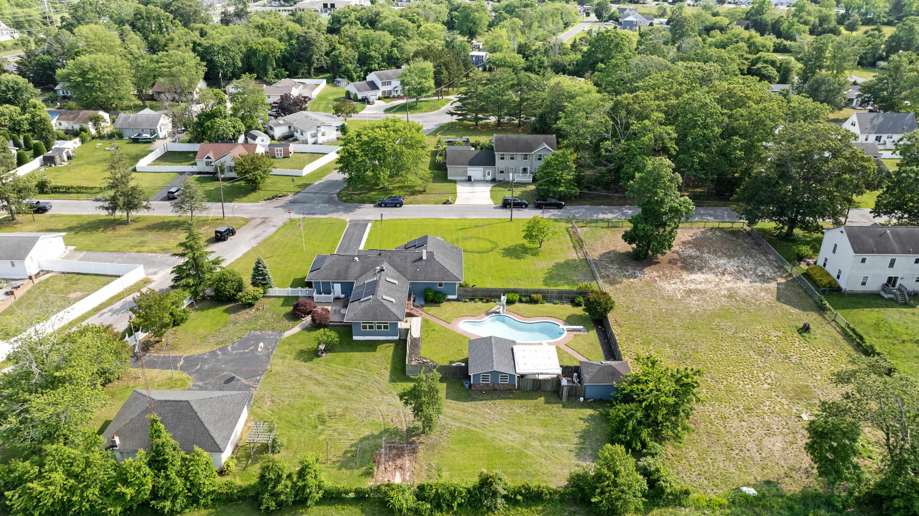 102 Teal Road Rio Grande, NJ 08242 - Photo 3 of 49 an aerial view of a house with swimming pool and outdoor seating