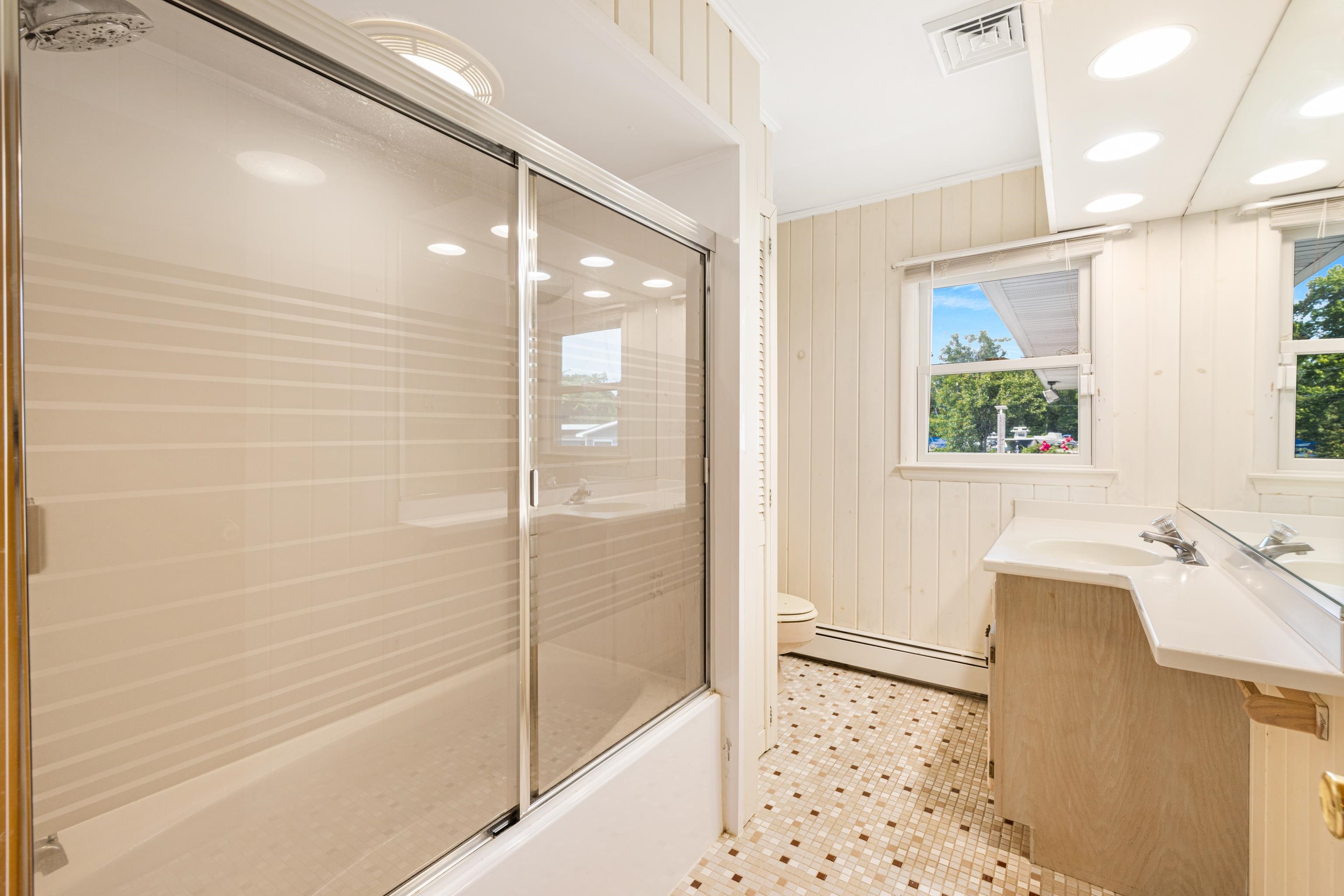 102 Teal Road Rio Grande, NJ 08242 - Photo 31 of 49 a bathroom with a bathtub and a shower