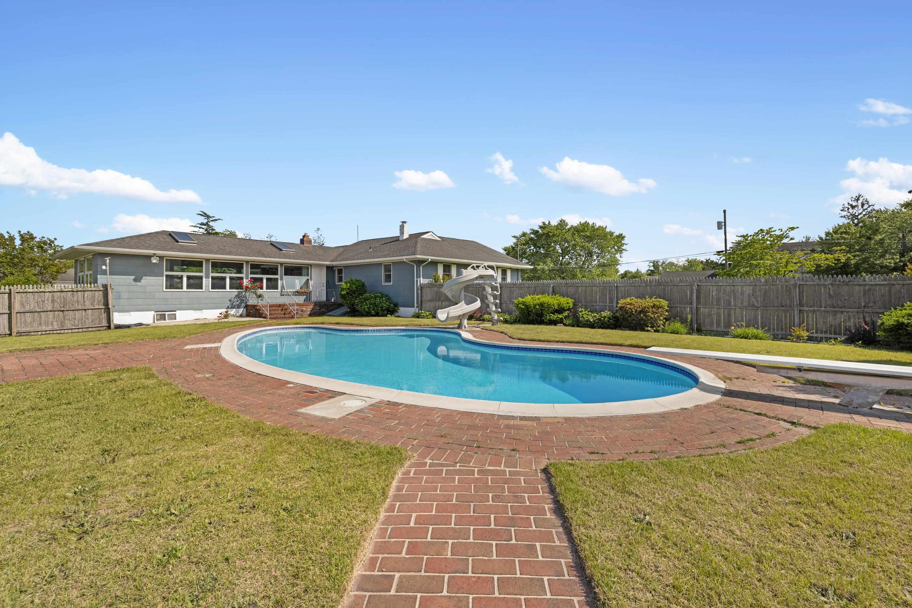 102 Teal Road Rio Grande, NJ 08242 - Photo 37 of 49 a view of a swimming pool with a lake view