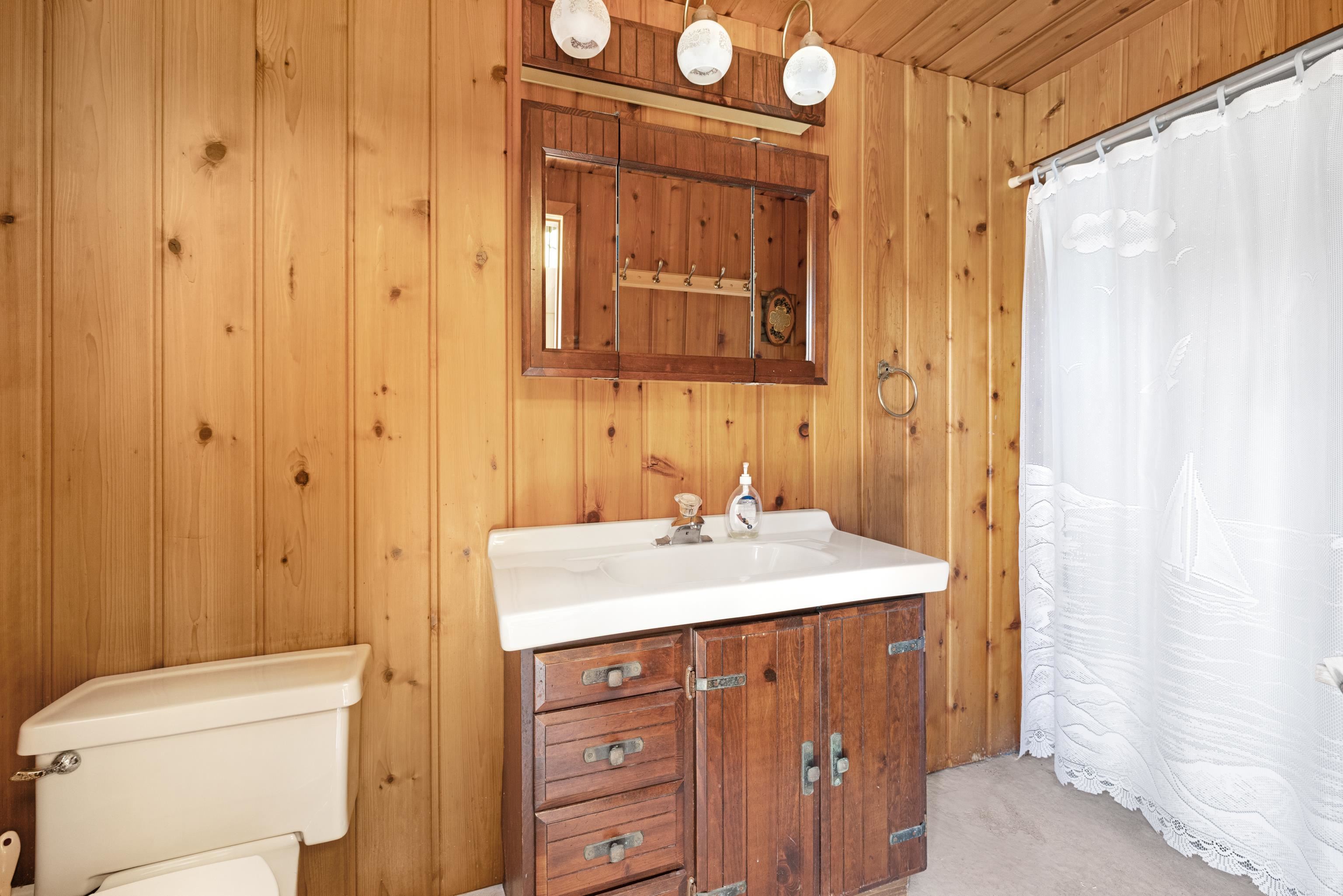 102 Teal Road Rio Grande, NJ 08242 - Photo 44 of 49 a bathroom with a sink a toilet and shower