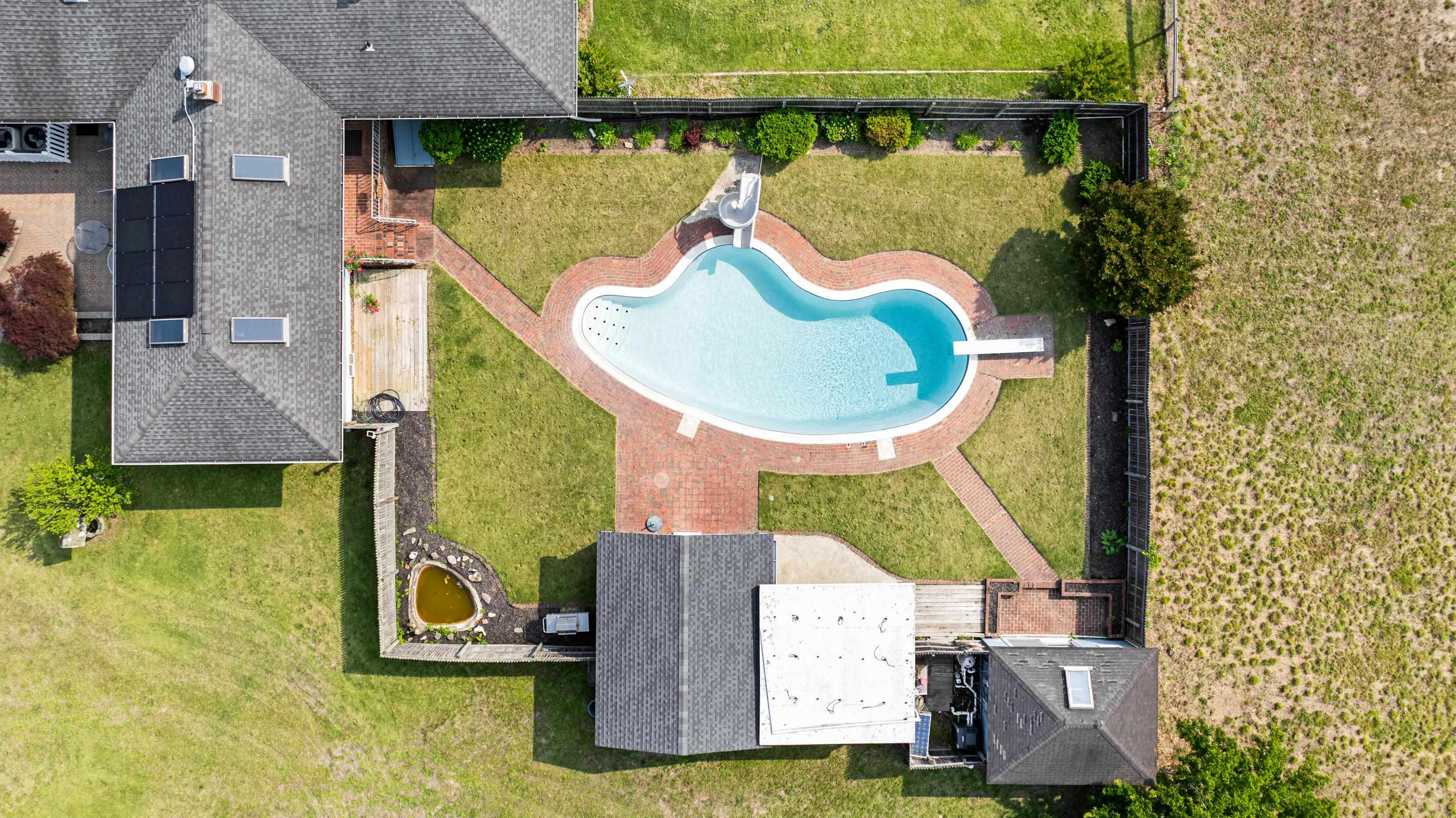 102 Teal Road Rio Grande, NJ 08242 - Photo 7 of 49 an aerial view of a house with swimming pool and glass doors