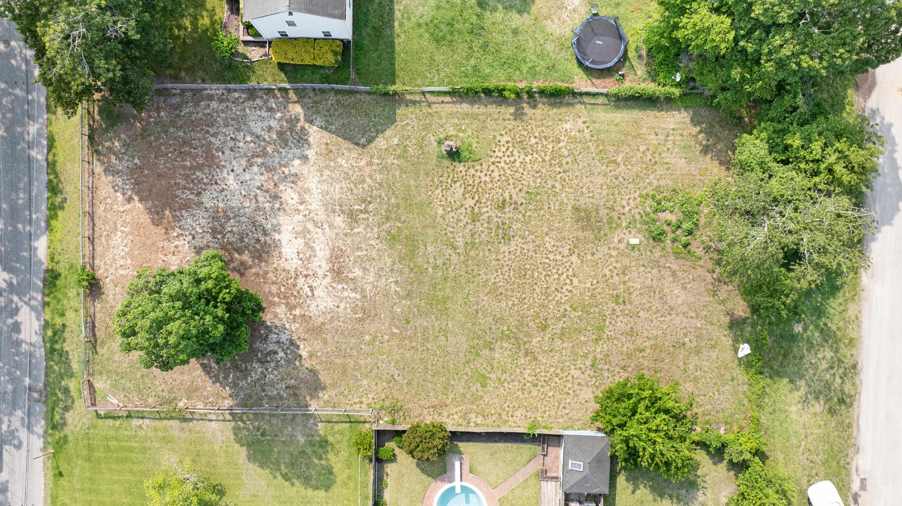102 Teal Road Rio Grande, NJ 08242 - Photo 9 of 49 an aerial view of a house with outdoor space and a lake view in back