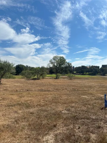 a view of lake with mountain in background