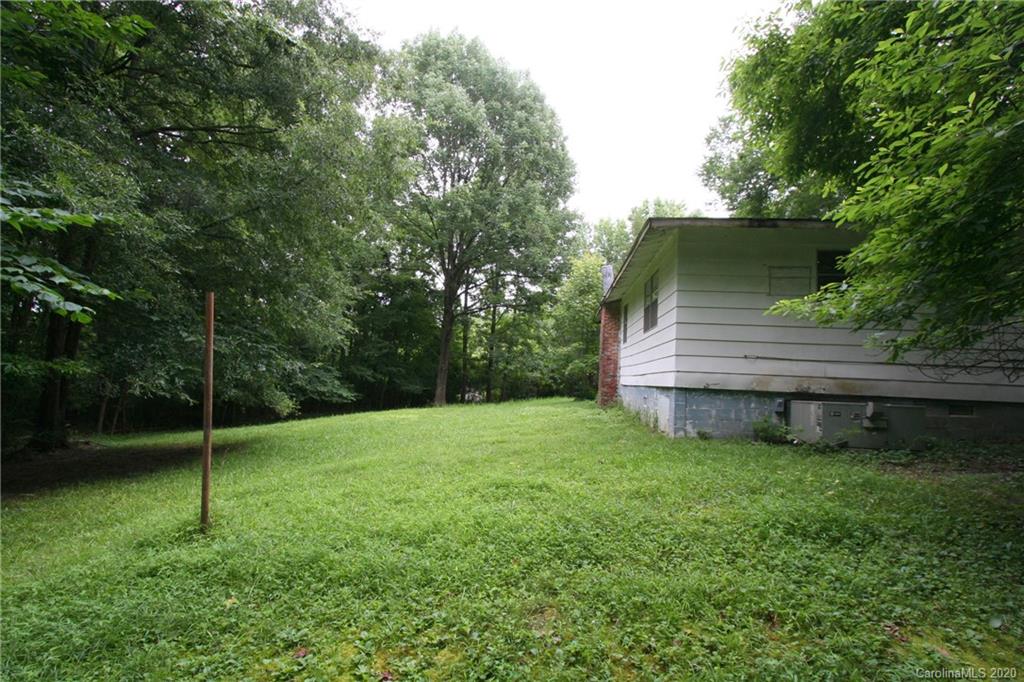 1400 Pleasant Plains Road Matthews, NC 28105 - Photo 12 of 31 a view of a wooden deck in the backyard