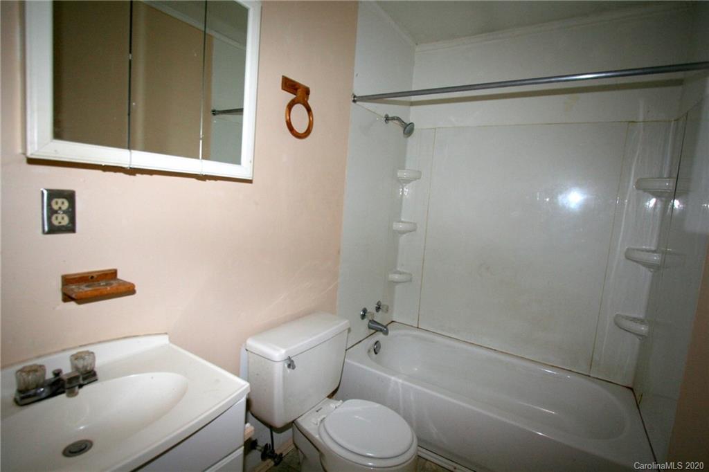 1400 Pleasant Plains Road Matthews, NC 28105 - Photo 22 of 31 a bathroom with a toilet and a shower