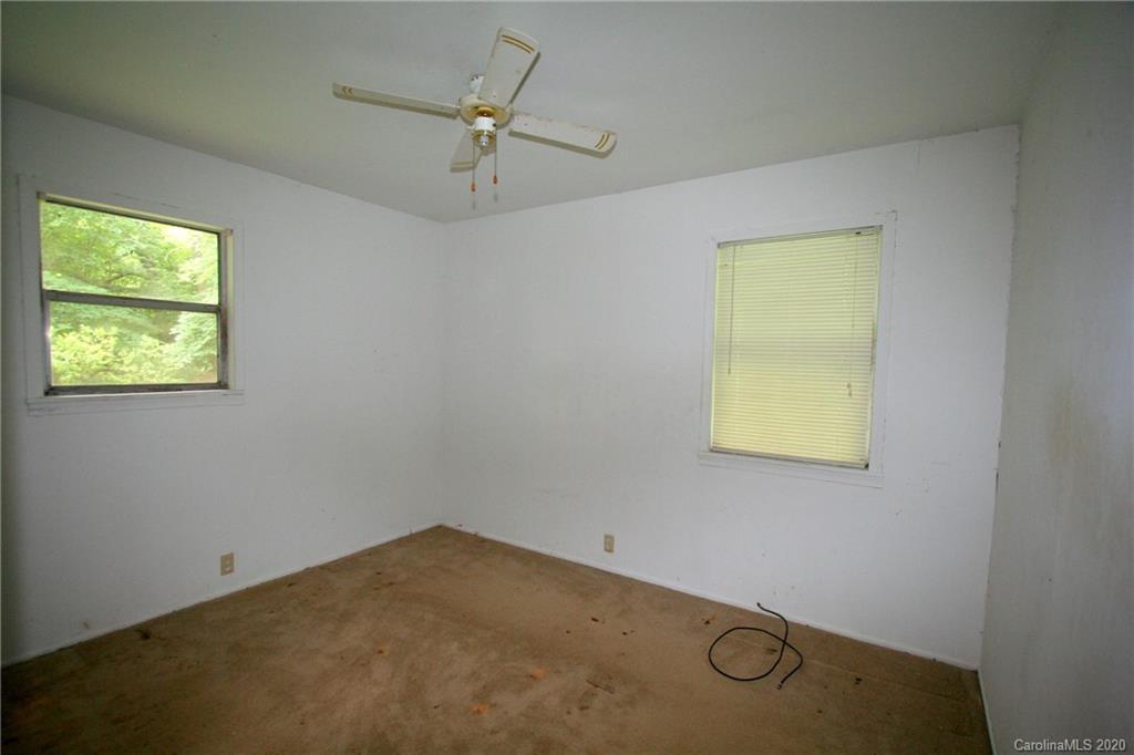 1400 Pleasant Plains Road Matthews, NC 28105 - Photo 24 of 31 an empty room with windows