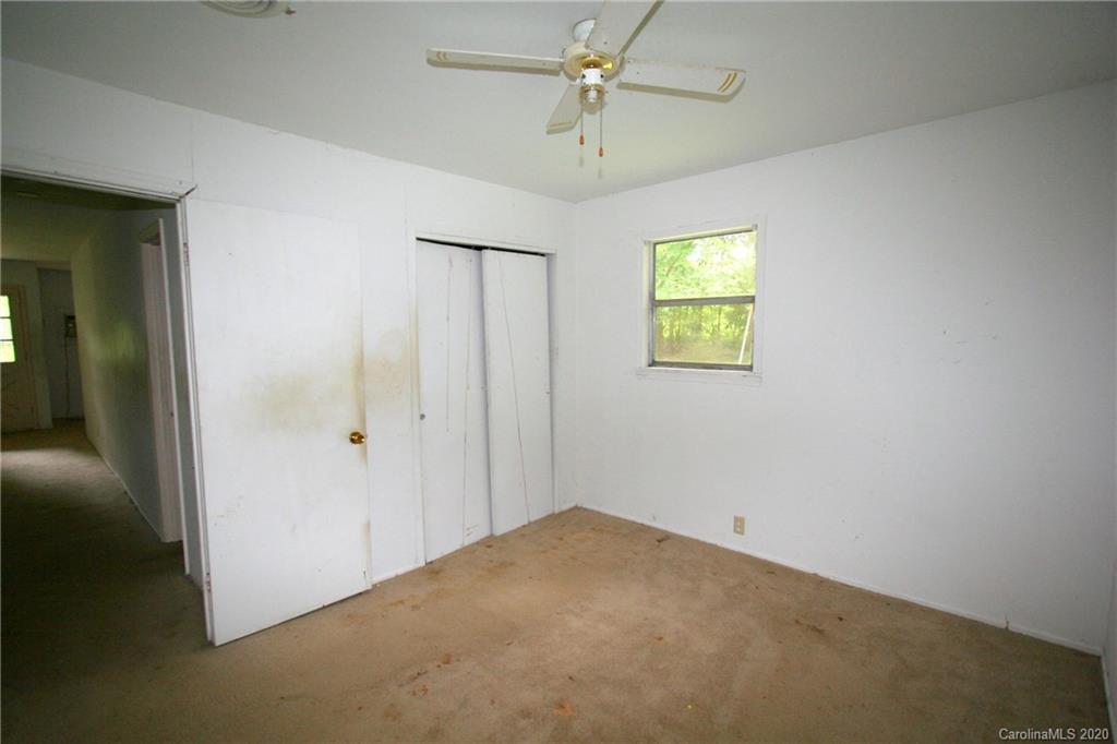 1400 Pleasant Plains Road Matthews, NC 28105 - Photo 25 of 31 an empty room with windows and closet