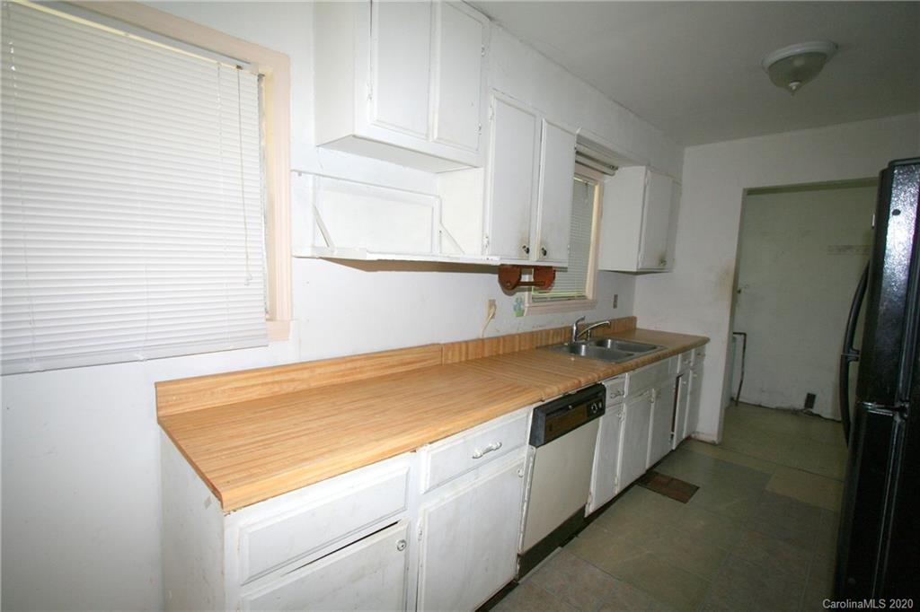 1400 Pleasant Plains Road Matthews, NC 28105 - Photo 26 of 31 a view of a kitchen with a sink and dishwasher