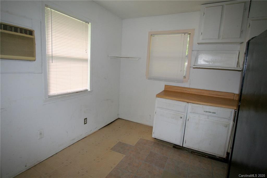 1400 Pleasant Plains Road Matthews, NC 28105 - Photo 29 of 31 a utility room with cabinets washer and dryer