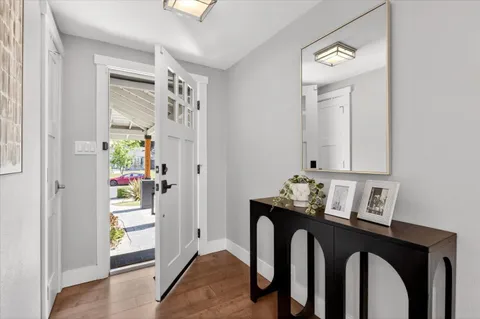 a view of hallway that has closet
