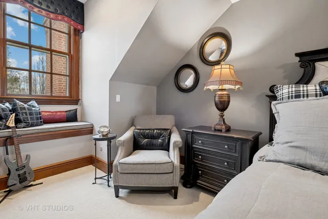 a kitchen with granite countertop a refrigerator a sink dishwasher a stove and white cabinets with wooden floor