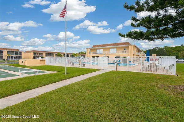 a view of a house with a big yard