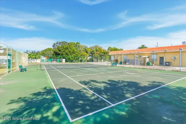 a view of an outdoor space and tennis court