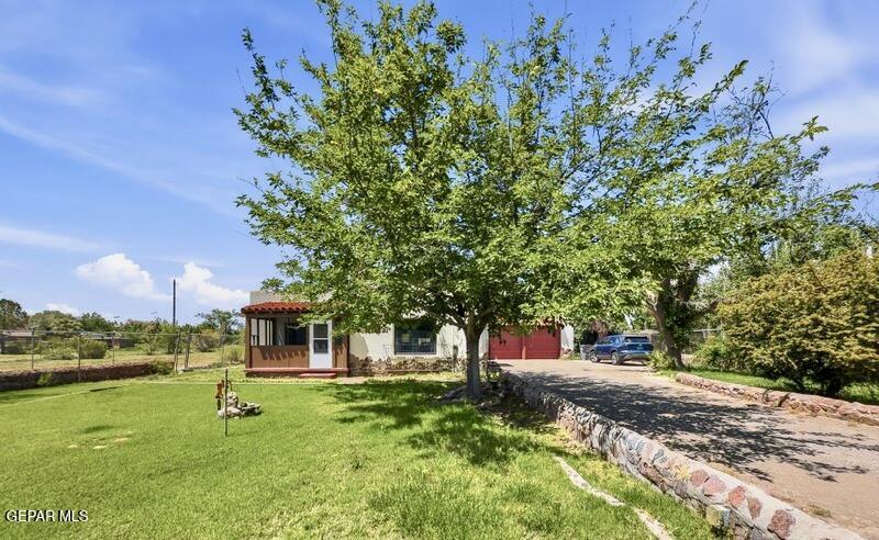 4135 Emory Road El Paso, TX 79922 - Photo 12 of 73 a front view of a house with a yard