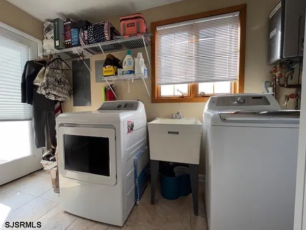 a utility room with dryer and washer