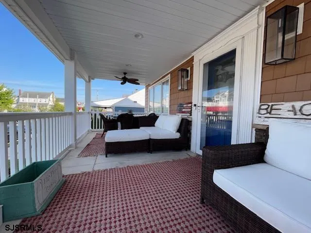 a living room with furniture and a rug