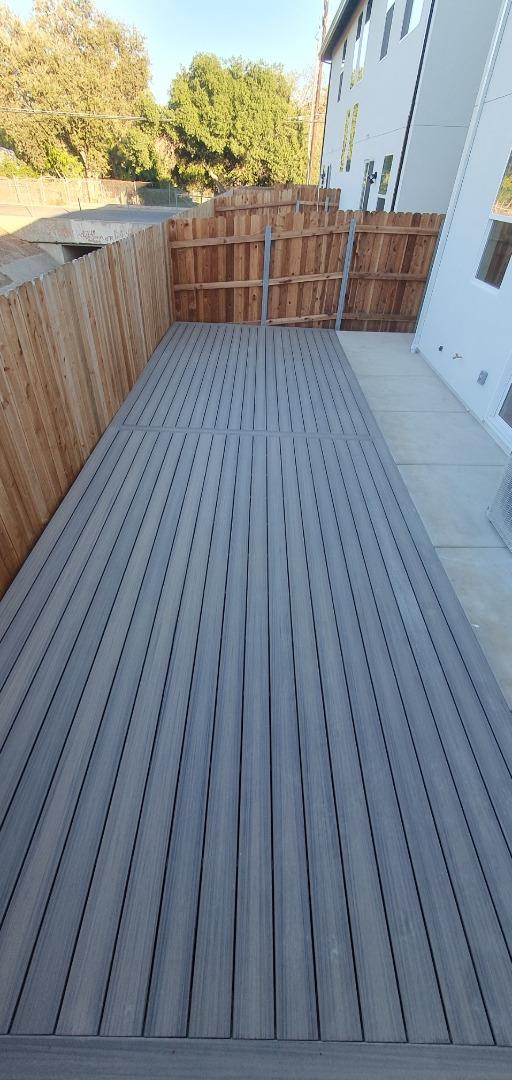 963 Olive Br Place, Unit 959 Sacramento, CA 95815 - Photo 11 of 12 a view of deck with wooden floor and outdoor space