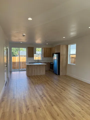 a view of a kitchen with a sink and a stove top oven
